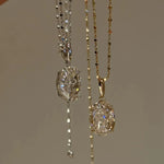 Side-by-side comparison of the 10 carat oval pendant necklaces in 925 sterling silver and rose gold finish.