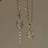 Side-by-side comparison of the 10 carat oval pendant necklaces in 925 sterling silver and rose gold finish.