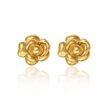 A pair of 14K gold plated stud earrings shaped like layered camellia flowers, isolated on a white background with a reflection.