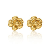 A pair of 14K gold plated stud earrings shaped like layered camellia flowers, isolated on a white background with a reflection.