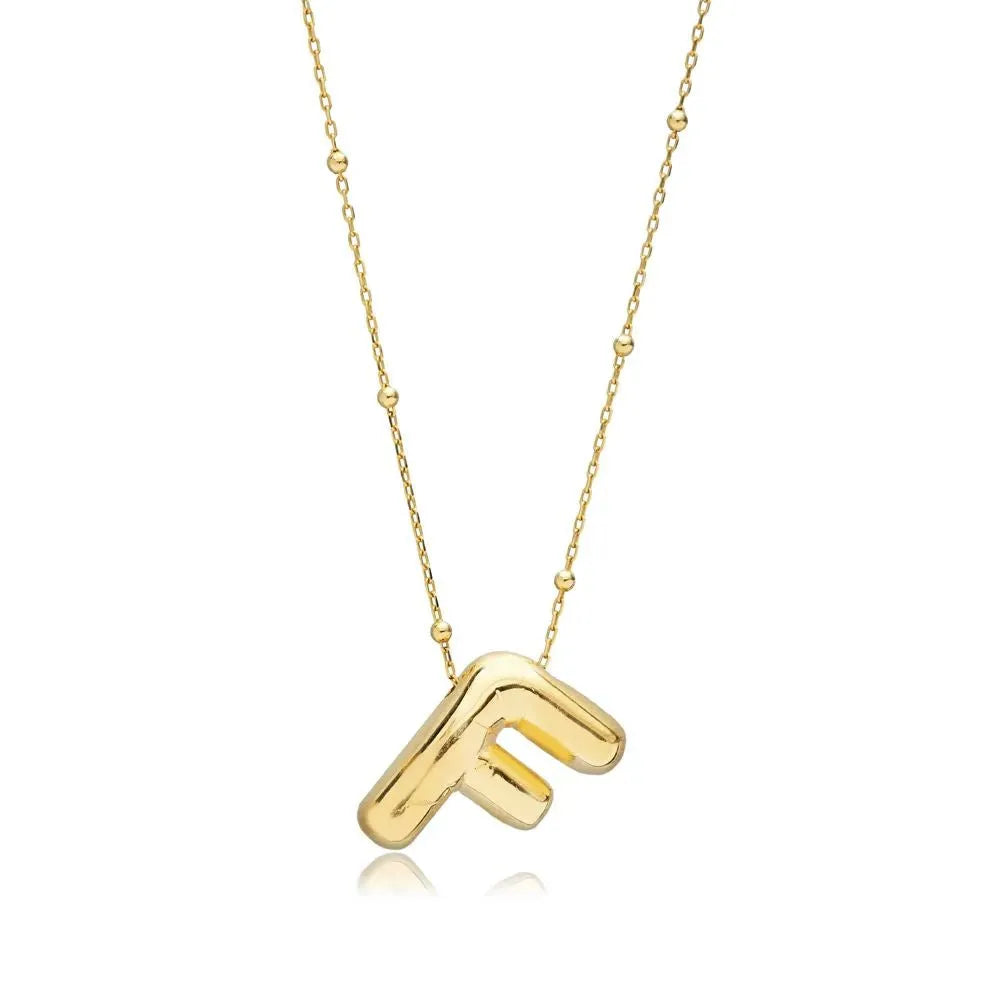 A shiny 18K gold plated 3D puff initial letter F pendant on a bean chain, isolated on a white background.