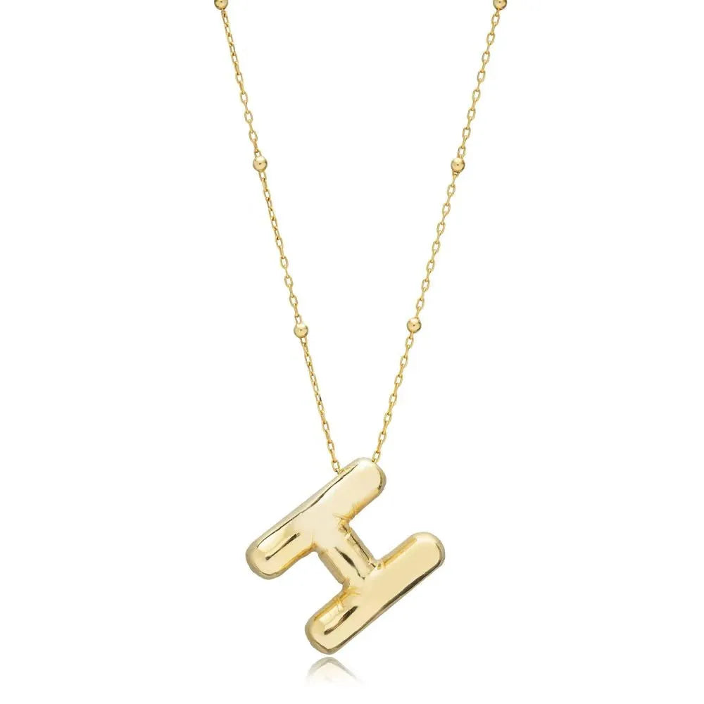 A shiny 18K gold plated 3D puff initial letter H pendant on a bean chain, isolated on a white background.