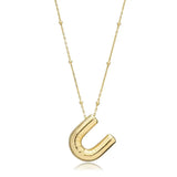 A shiny 18K gold plated 3D puff initial letter U pendant on a bean chain, isolated on a white background.