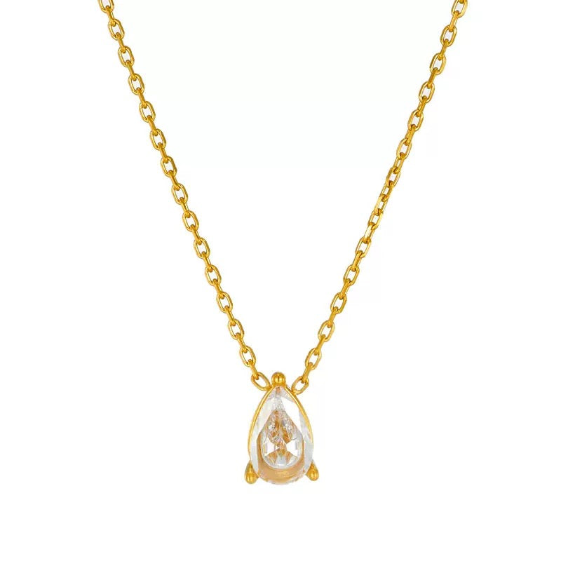 Flat lay of a single 18k gold plated dainty chain necklace featuring a solitary, delicate pear (teardrop) cut simulated gemstone pendant.
