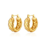 Professional product shot of 18K gold-plated quilted hoop earrings with a distinctive textured surface.