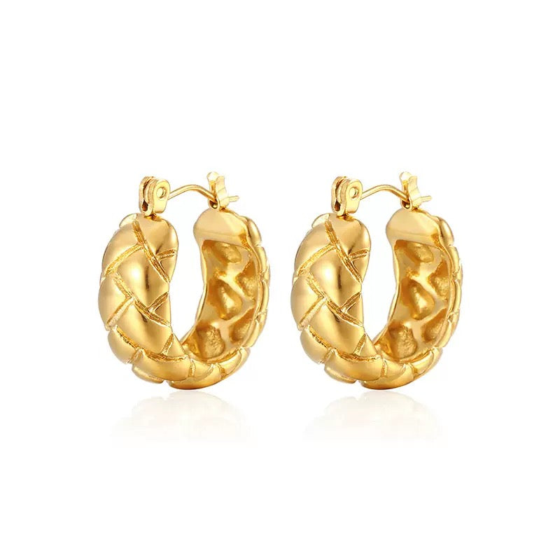 Professional product shot of 18K gold-plated quilted hoop earrings with a distinctive textured surface.