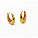 A pair of chunky 18k gold plated U-shape hoop earrings displayed against a plain white background.