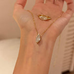 18k gold plated marquise cut simulated diamond necklace and matching ring on hand