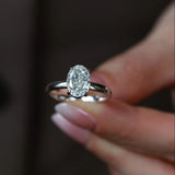 A 3 ct brilliant oval lab-grown diamond ring featuring a unique ice-flower cut, set in a minimalist four-prong solitaire.