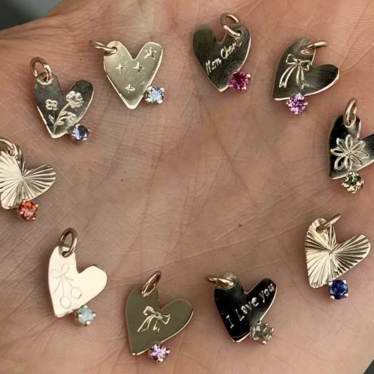 Collection of heart-shaped pendants on a wooden surface