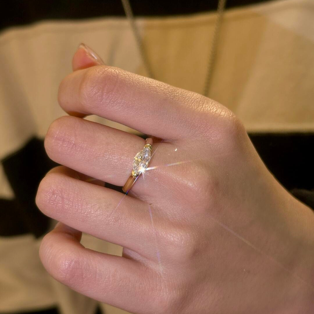 A model wearing the 18K gold Stardust Marquise Ring, highlighting its modern silhouette and elongated look.