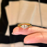 A model wearing the 18K gold Stardust Marquise Ring, highlighting its modern silhouette and elongated look.