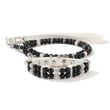 A matching set featuring a black simulated pearl pet collar resting on top of a coiled black pearl leash.