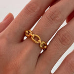 Close-up of the 18K gold chain link ring on a finger, highlighting its thick, premium plating and lustrous finish