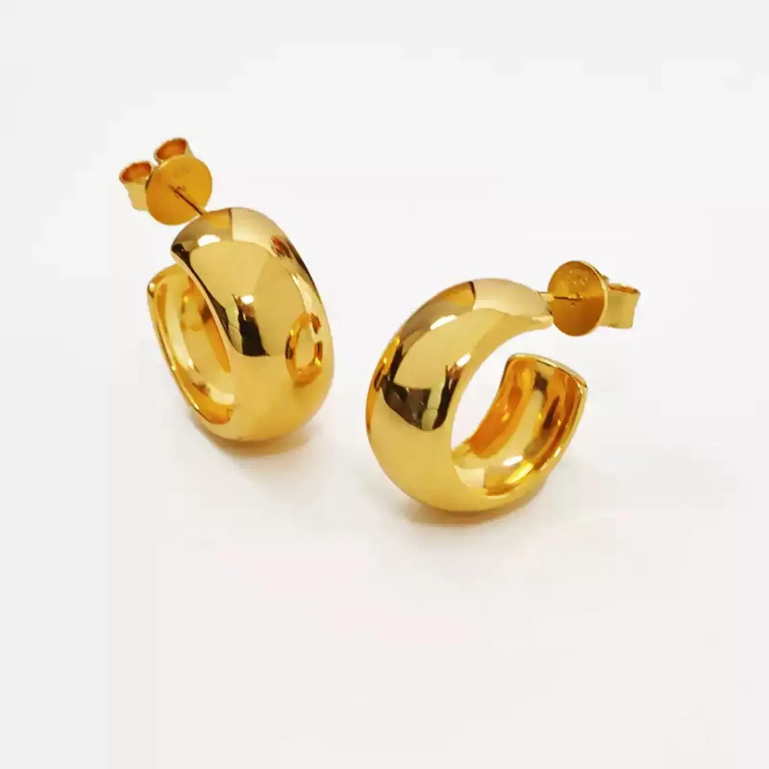 Chunky polished dome hoop earrings crafted from hypoallergenic S925 sterling silver, available in 18k gold plated and silver finishes.