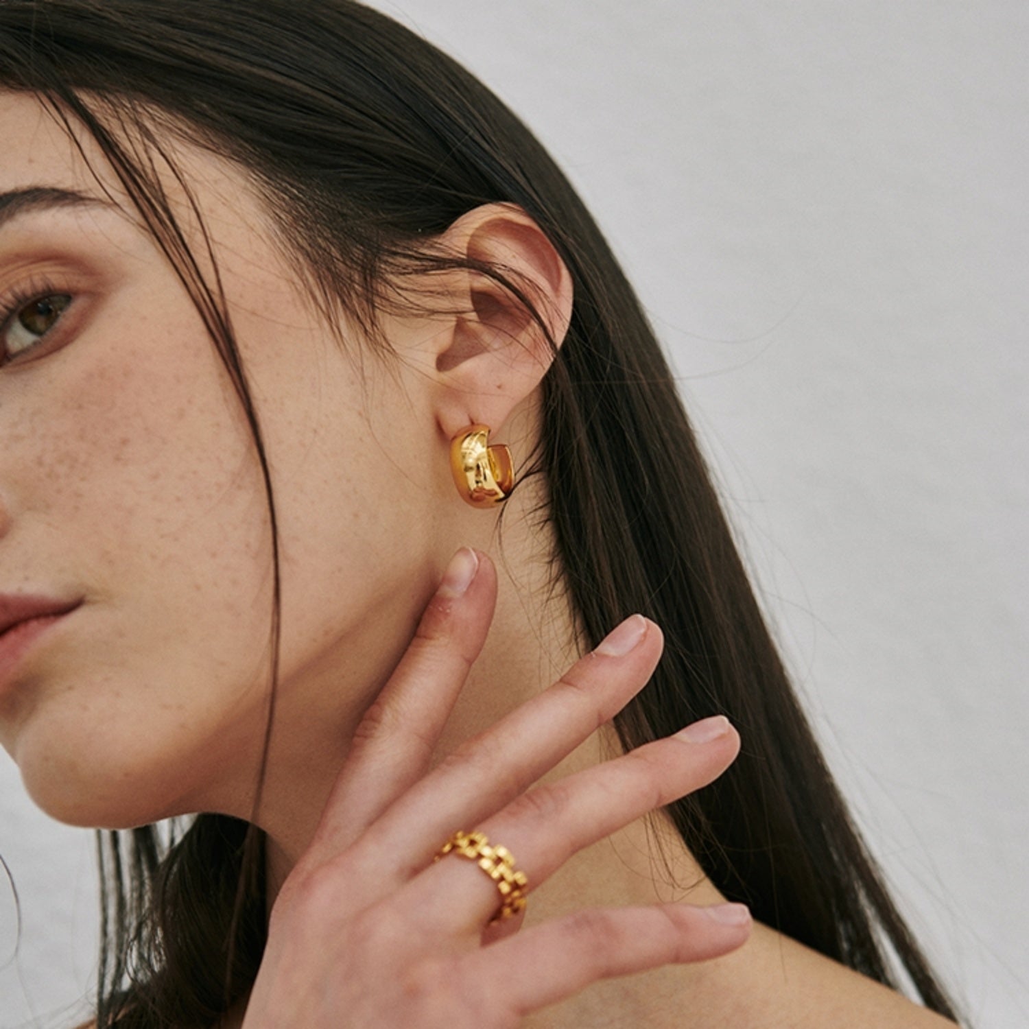 Chunky polished dome hoop earrings crafted from hypoallergenic S925 sterling silver, available in 18k gold plated and silver finishes.