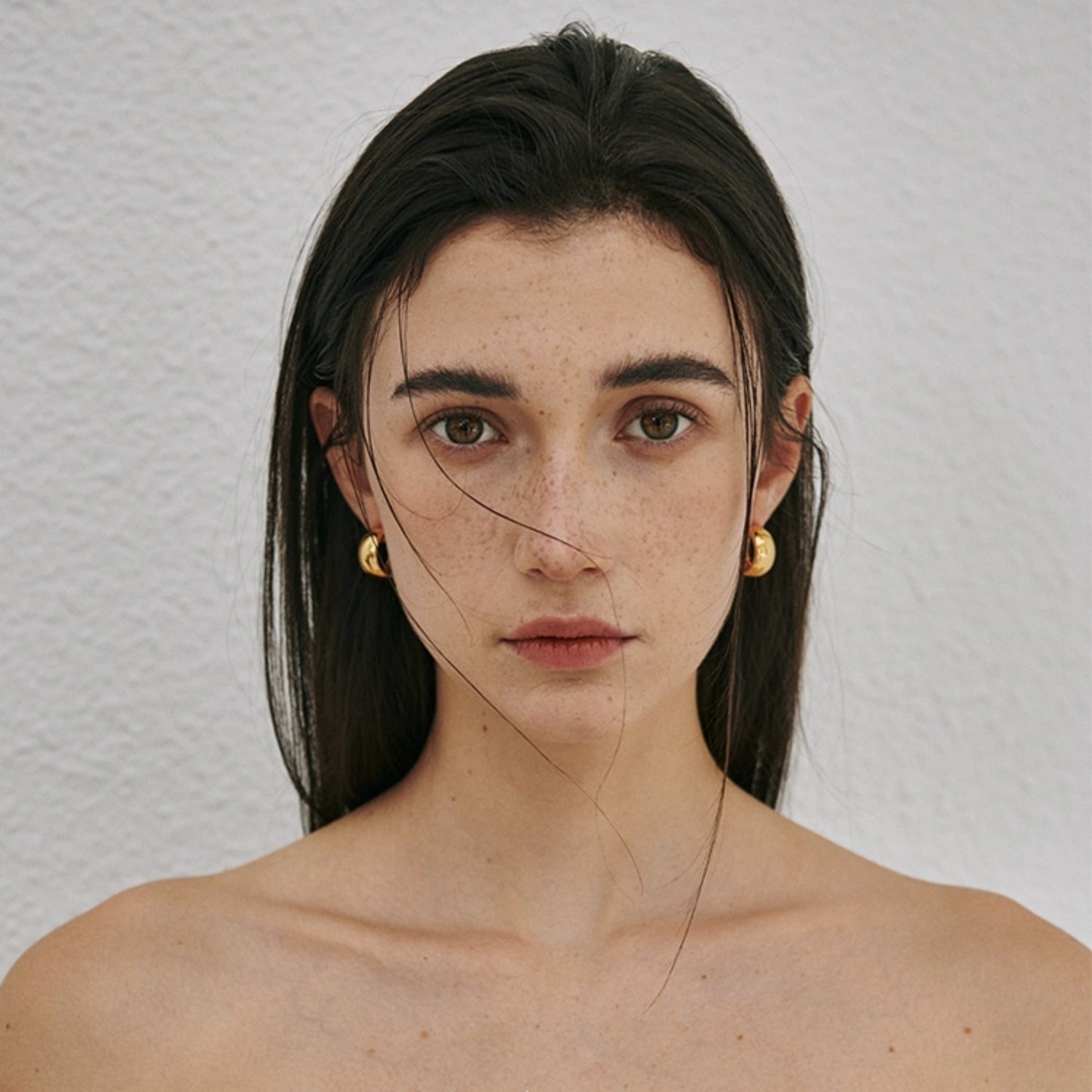 Chunky polished dome hoop earrings crafted from hypoallergenic S925 sterling silver, available in 18k gold plated and silver finishes.