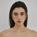 Chunky polished dome hoop earrings crafted from hypoallergenic S925 sterling silver, available in 18k gold plated and silver finishes.