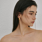 Chunky polished dome hoop earrings crafted from hypoallergenic S925 sterling silver, available in 18k gold plated and silver finishes.