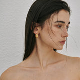 Chunky polished dome hoop earrings crafted from hypoallergenic S925 sterling silver, available in 18k gold plated and silver finishes.