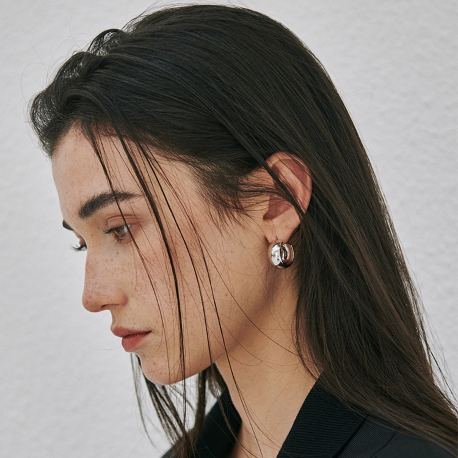 Chunky polished dome hoop earrings crafted from hypoallergenic S925 sterling silver, available in 18k gold plated and silver finishes.