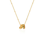 Professional studio shot of the 18K gold-plated Emerald Trio Ring Necklace on a clean white background.