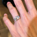 A hand wearing the silver Toi et Moi ring with double stones, showcasing its brilliant shine and everyday fit.