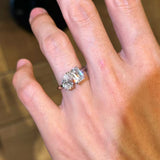 A hand wearing the silver Toi et Moi ring with double stones, showcasing its brilliant shine and everyday fit.