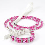 A hot pink simulated pearl pet collar and matching beaded leash set against a white background.