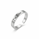 A sleek silver adjustable ring with the words "I'm fine." engraved in black on the outside, isolated on a white background.