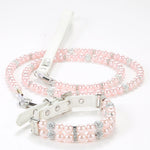 A delicate light pink simulated pearl pet collar paired with a matching pink pearl leash.
