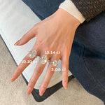 A visual size comparison of the oval lab diamond rings on a hand, showcasing the impressive scale from 3.08 ct up to 13.14 ct.