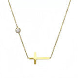 The complete delicate gold chain featuring an off-center sideways cross, shown against a clean white background.