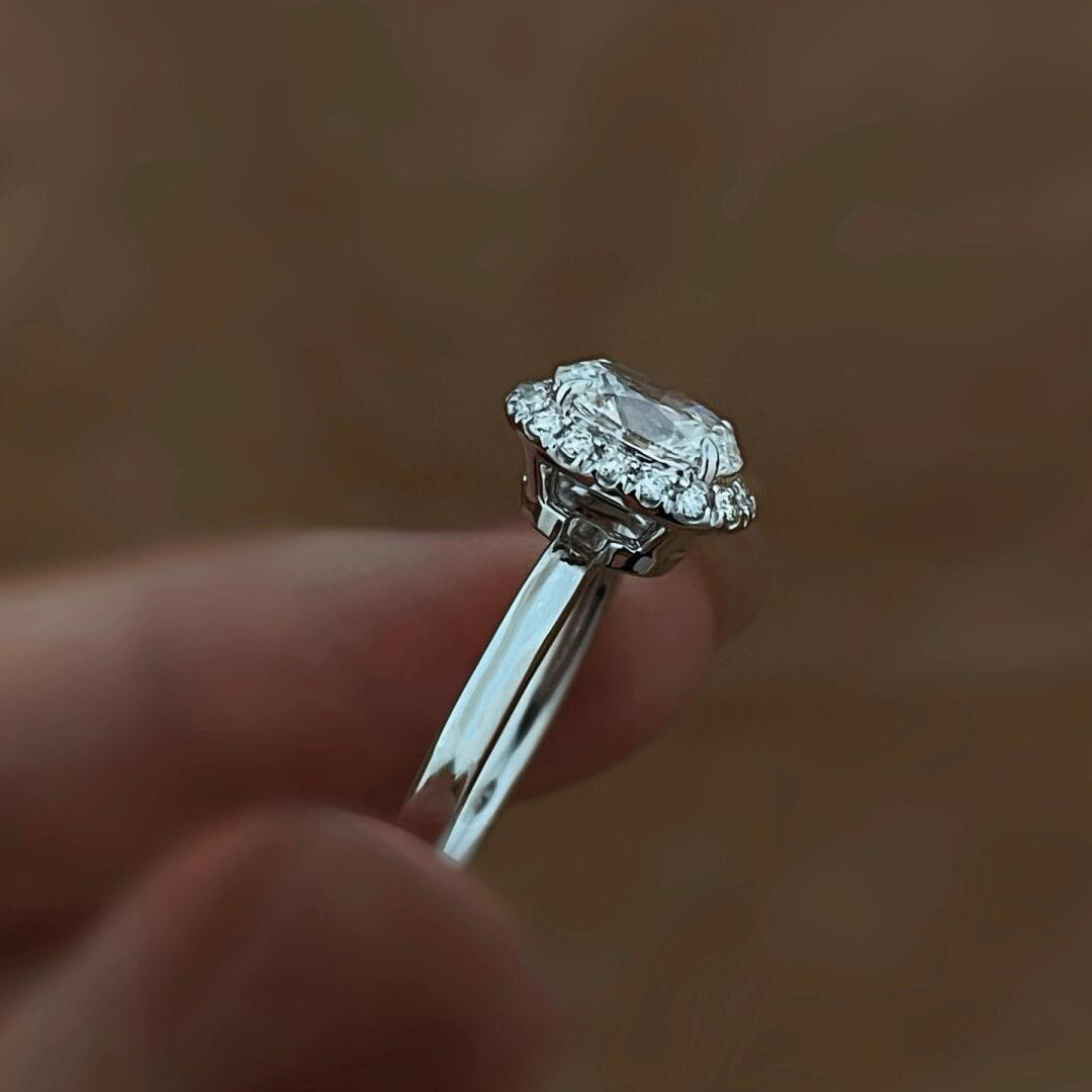 Side profile of the Stella Crown ring, showcasing the elegant open-gallery cathedral setting in solid PT950 platinum.