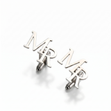 Silver 'MR' cufflinks on a white background