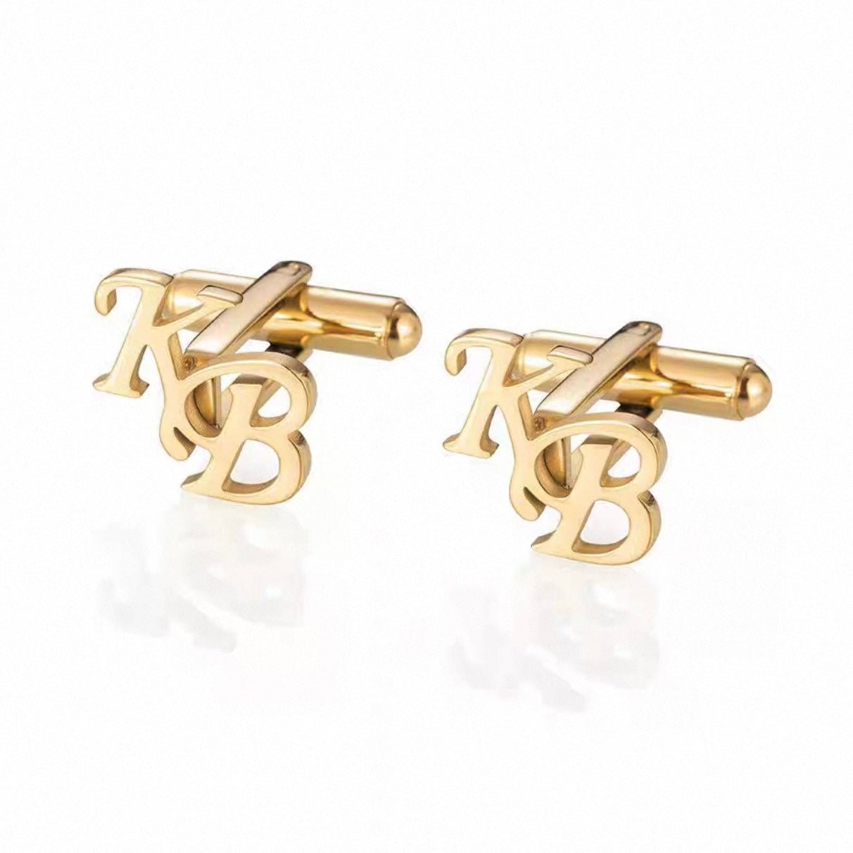 Gold cufflinks with 'KB' initials on a white background