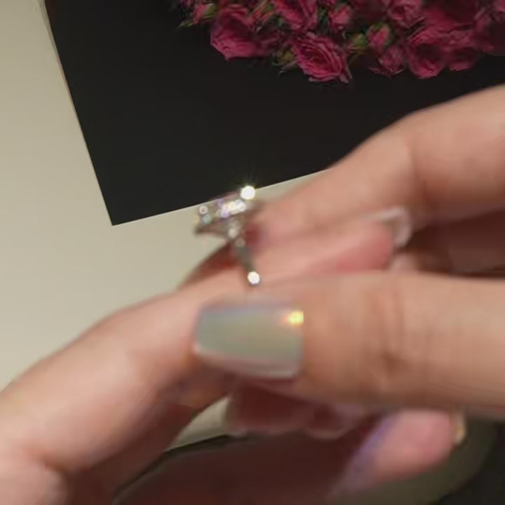 A short clip showing the mesmerizing sparkle and light return of the 2.06 ct oval halo lab diamond ring under natural lighting.