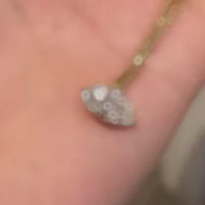 A dynamic video highlighting the flexibility of the 18K gold woven chain and the exceptional sparkle of the 1ct marquise lab diamond.