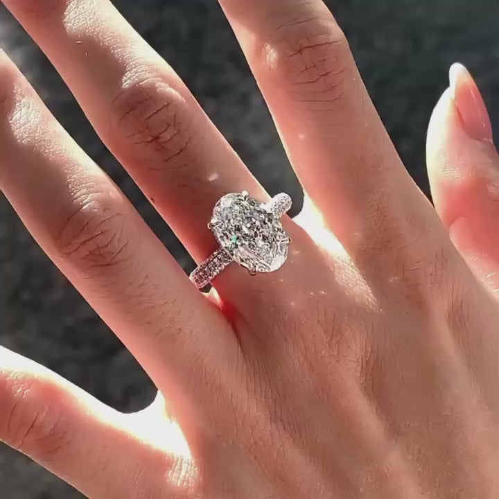 Dynamic video demonstrating the blinding sparkle and flawless D VVS2 clarity of the oversized oval lab diamond ring.