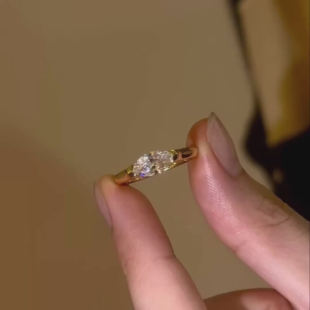 A video showcasing the exceptional light return and rainbow fire of the VVS1 marquise diamond under cinematic lighting.