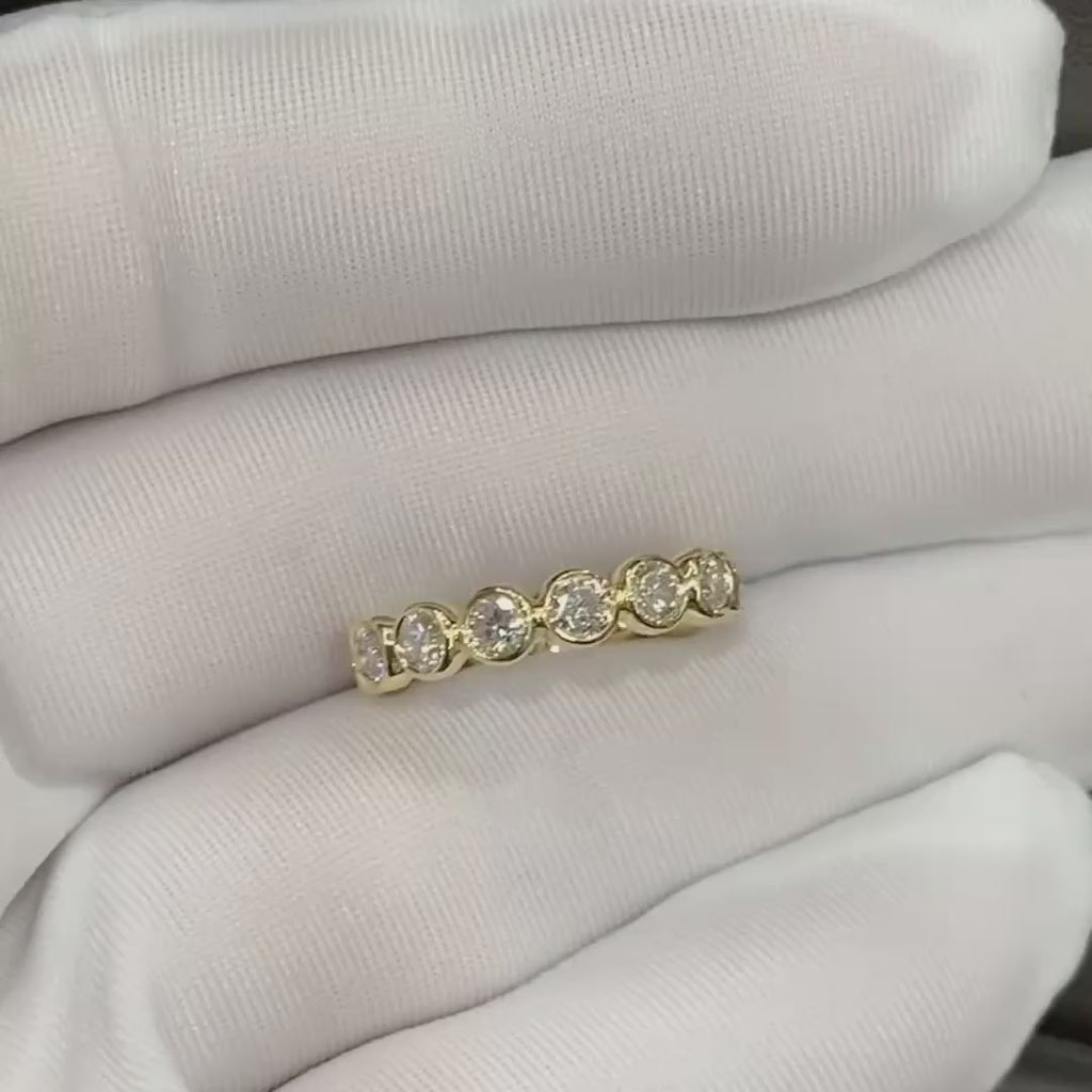 Close-up of the shared-prong bubble bezel setting, showing how the diamonds are held for maximum light return.