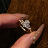 Close-up of the Shooting Star Spark lab-grown diamond ring featuring a brilliant oval center stone and a curved diamond trail on a gold band.