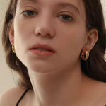 Side profile view of a gold-plated colorful gemstone hoop, emphasizing the thick 6mm band and secure click-in clasp.