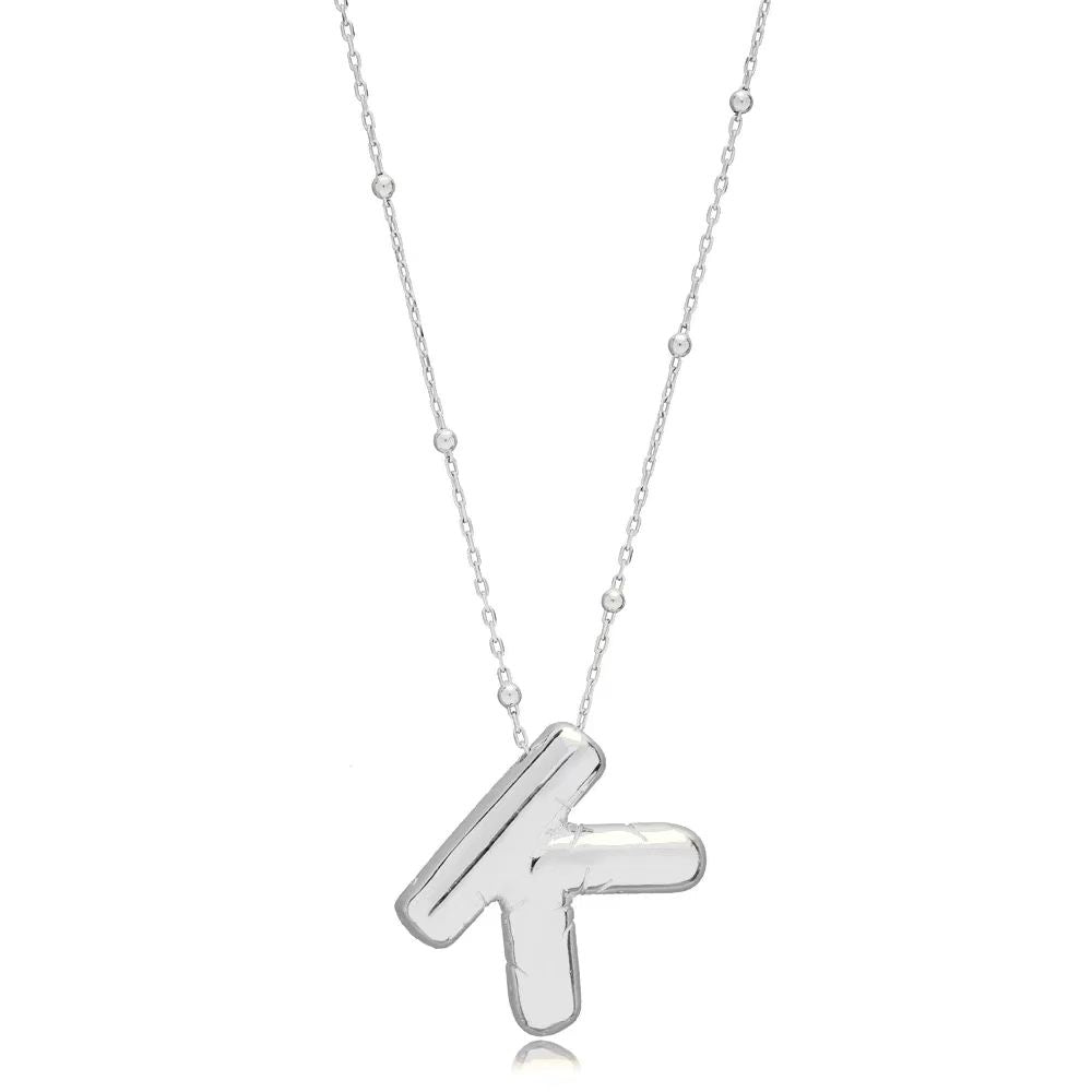 A high polish silver 3D balloon letter K initial pendant attached to a sleek silver bean chain, isolated on a white background.