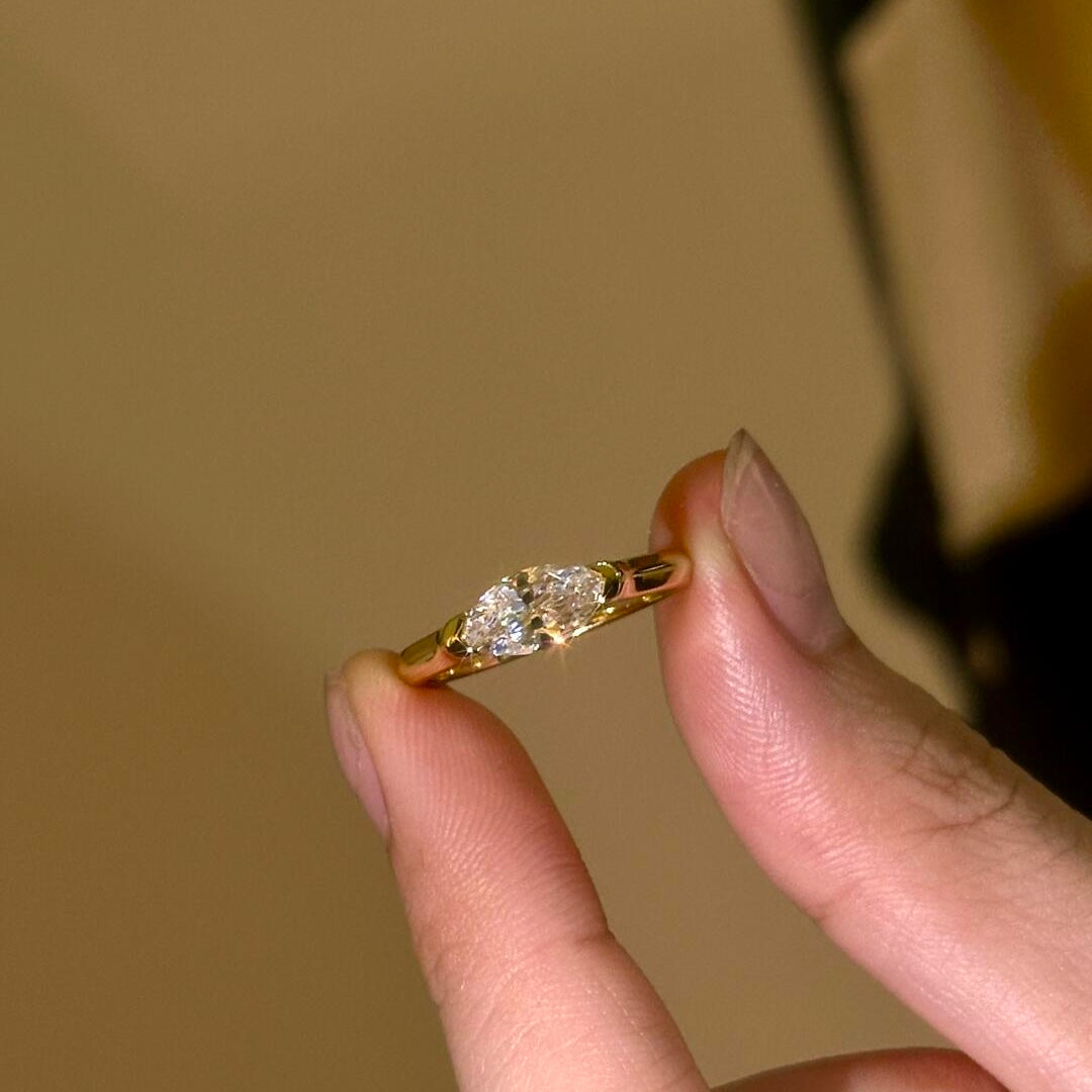 A model wearing the 18K gold Stardust Marquise Ring, highlighting its modern silhouette and elongated look.