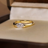 A marquise-cut lab diamond ring in 18K yellow gold, nestled in a premium velvet-lined ring box.