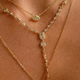 Model wearing the complete 3-piece Trinity Gemstone Layering Necklace Set in 18K gold.
