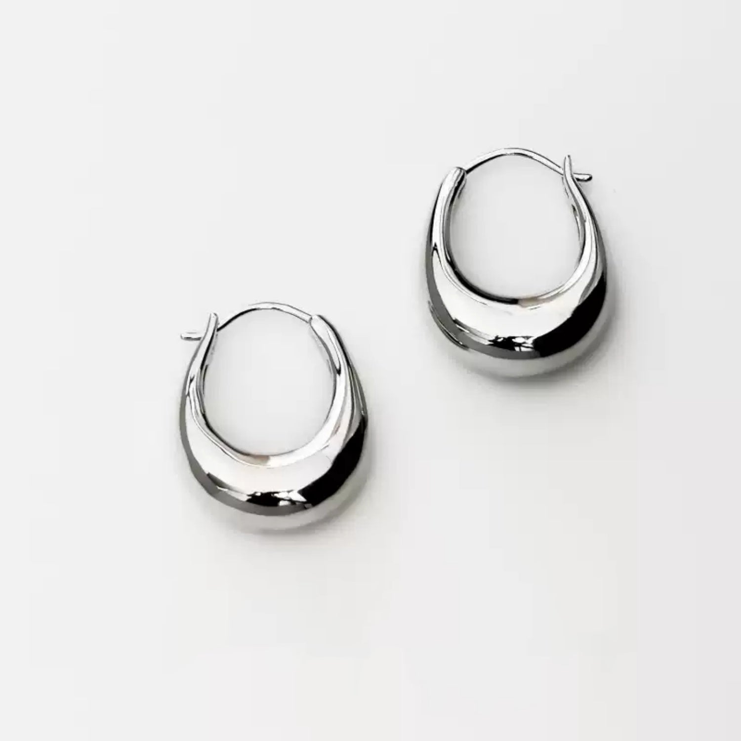 Detailed shot of the secure click-top latch closure on the S925 sterling silver U-shape earring.