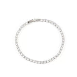 Top-down product photograph of a sleek white gold diamond tennis bracelet on a clean white background.
