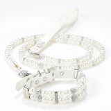 An elegant white simulated pearl pet collar displayed together with a matching white pearl leash.